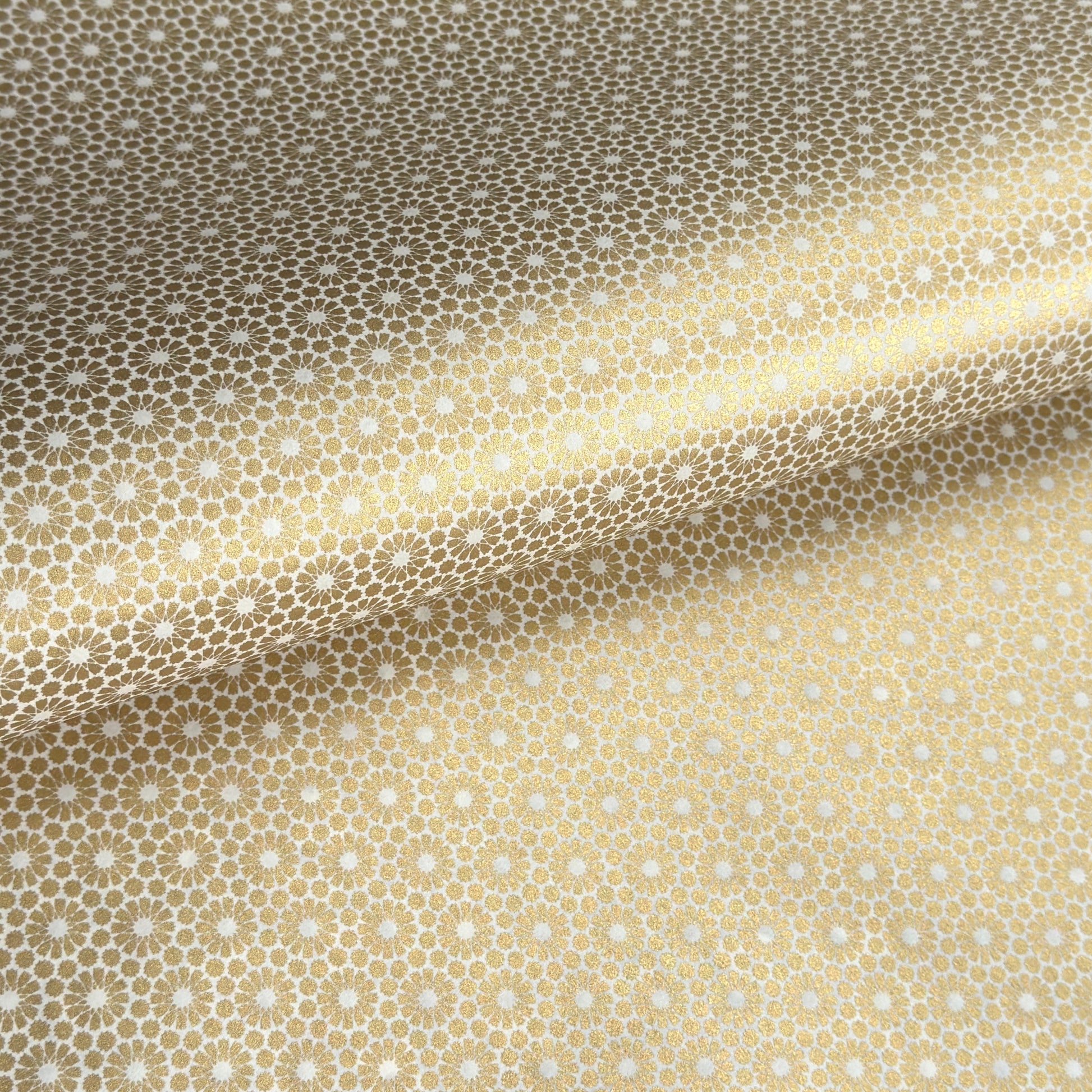 japanese silk-screen handmade paper showing gold repeat chrysanthemum flower motif repeat