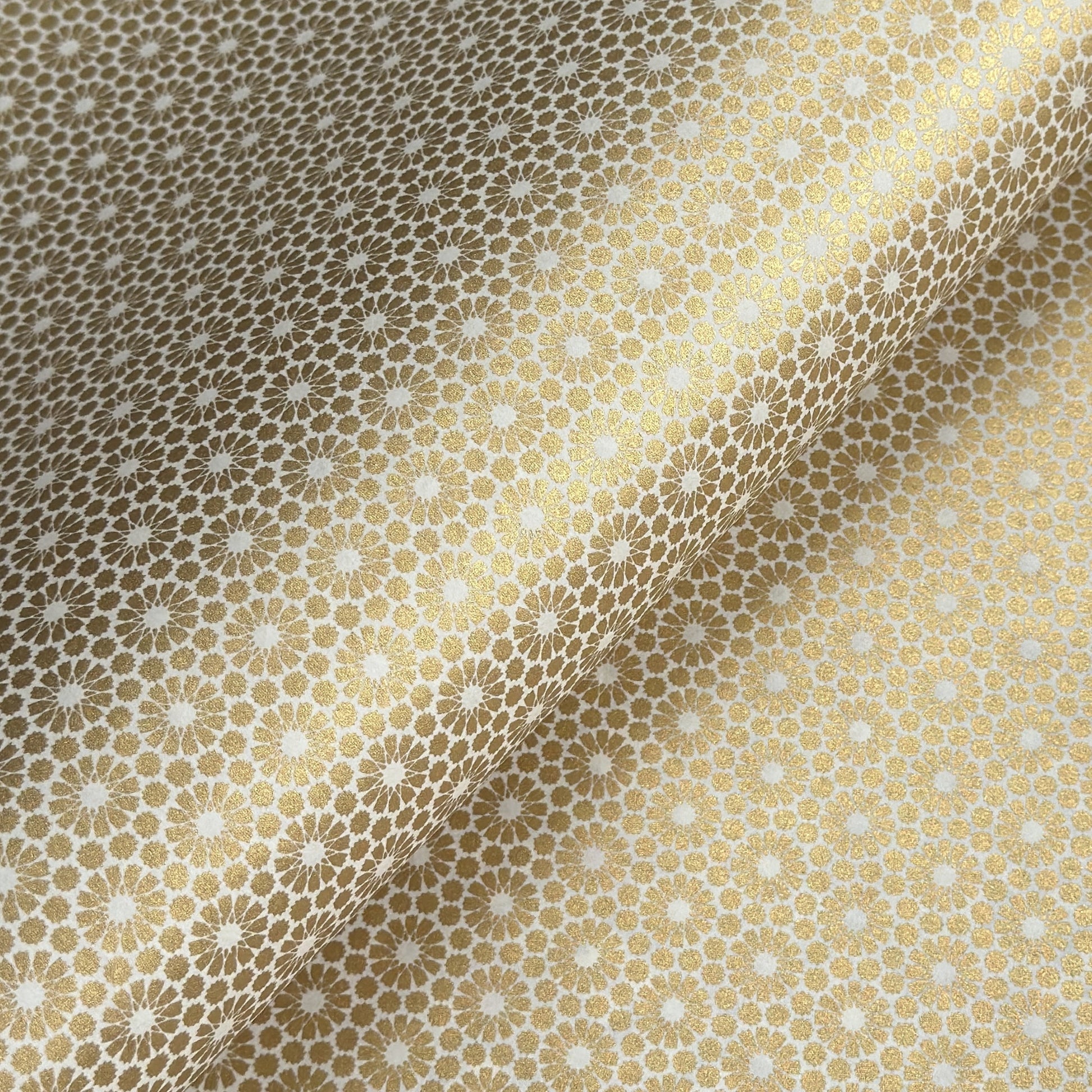 japanese silk-screen handmade paper showing gold repeat chrysanthemum flower motif repeat