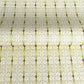 japanese silk-screen handmade paper showing green filigree pattern with gold accents