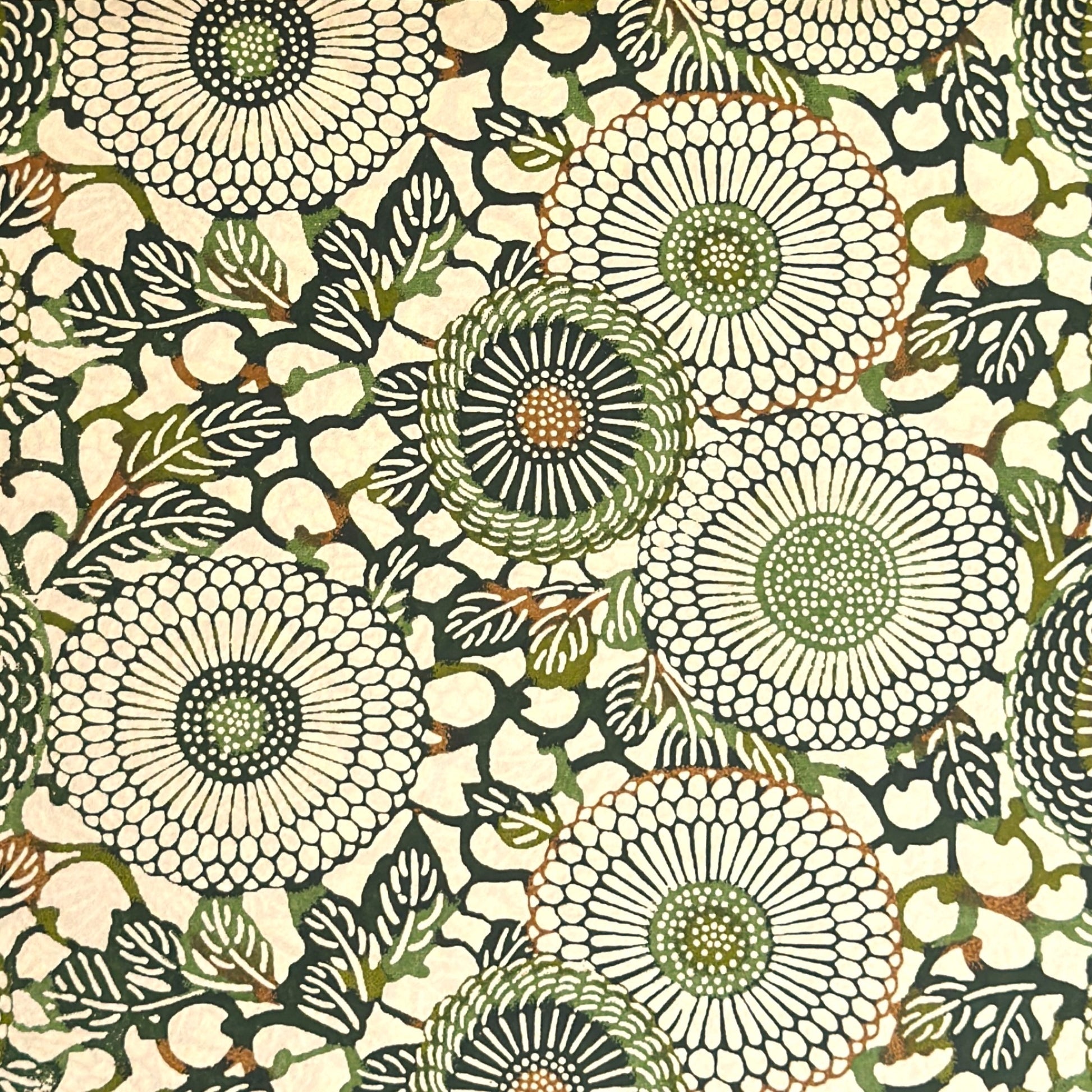 Japanese silkscreen chiyogami paper with a repeat pattern of stylised chrysanthemum flowers in tones of deep green on a buttermilk cream backdrop.