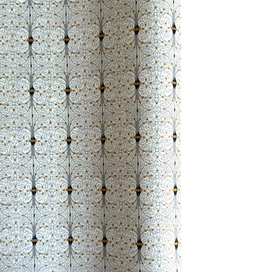 Japanese silkscreen chiyogami paper with a intricate filigree trellis design in grey with gold accent