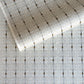 Japanese silkscreen chiyogami paper with a intricate filigree trellis design in grey with gold accent