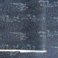Japanese chiyogami paper.  Inky blue with a subtle pattern of a riverbank of flowers.  