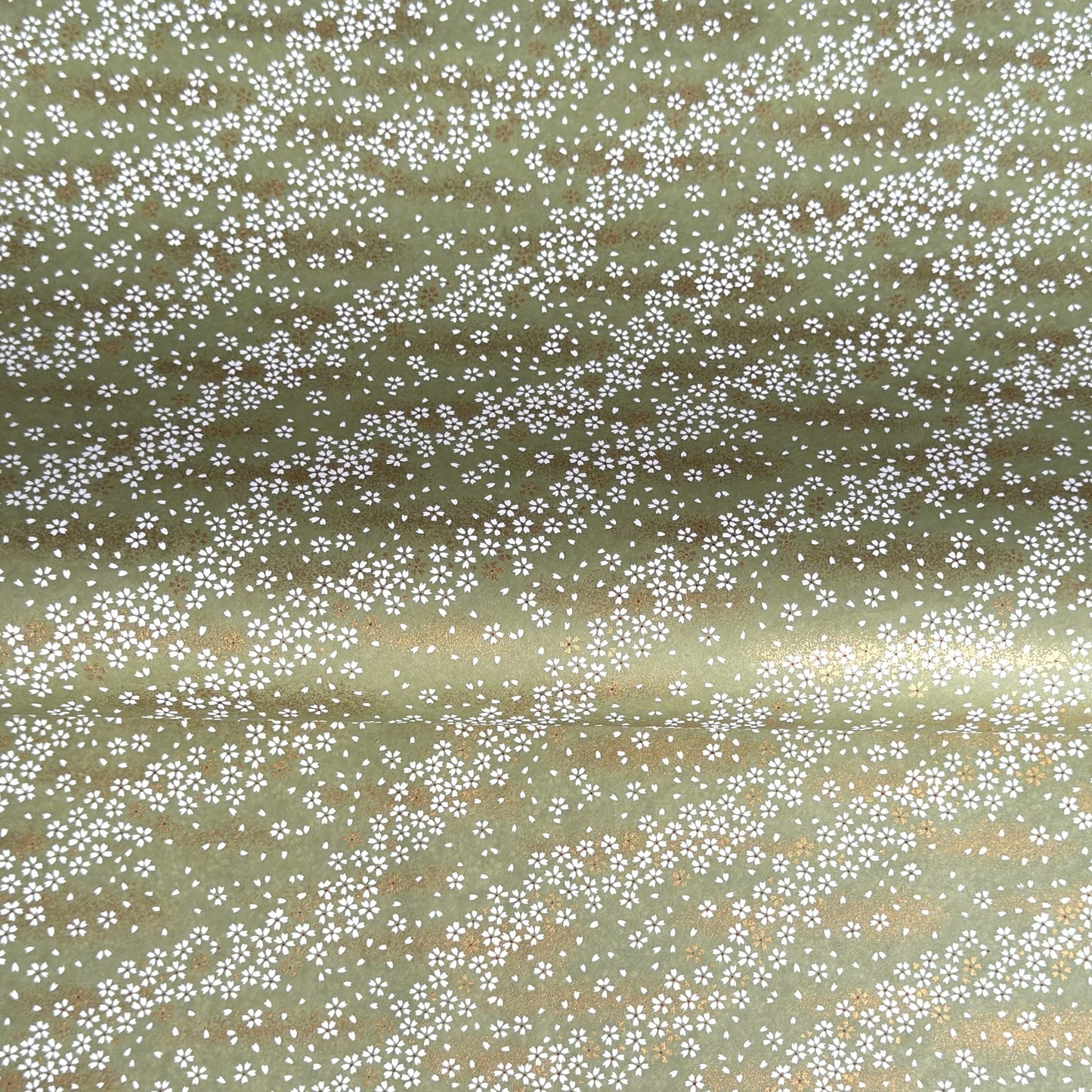 Waves of dainty white and gold flowers on a sage backdrop. Japanese chiyogami paper