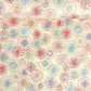 japanese chiyogami silkscreen printed paper with a pattern of fireworks in reds, pinks and lilacs on an ivory background.