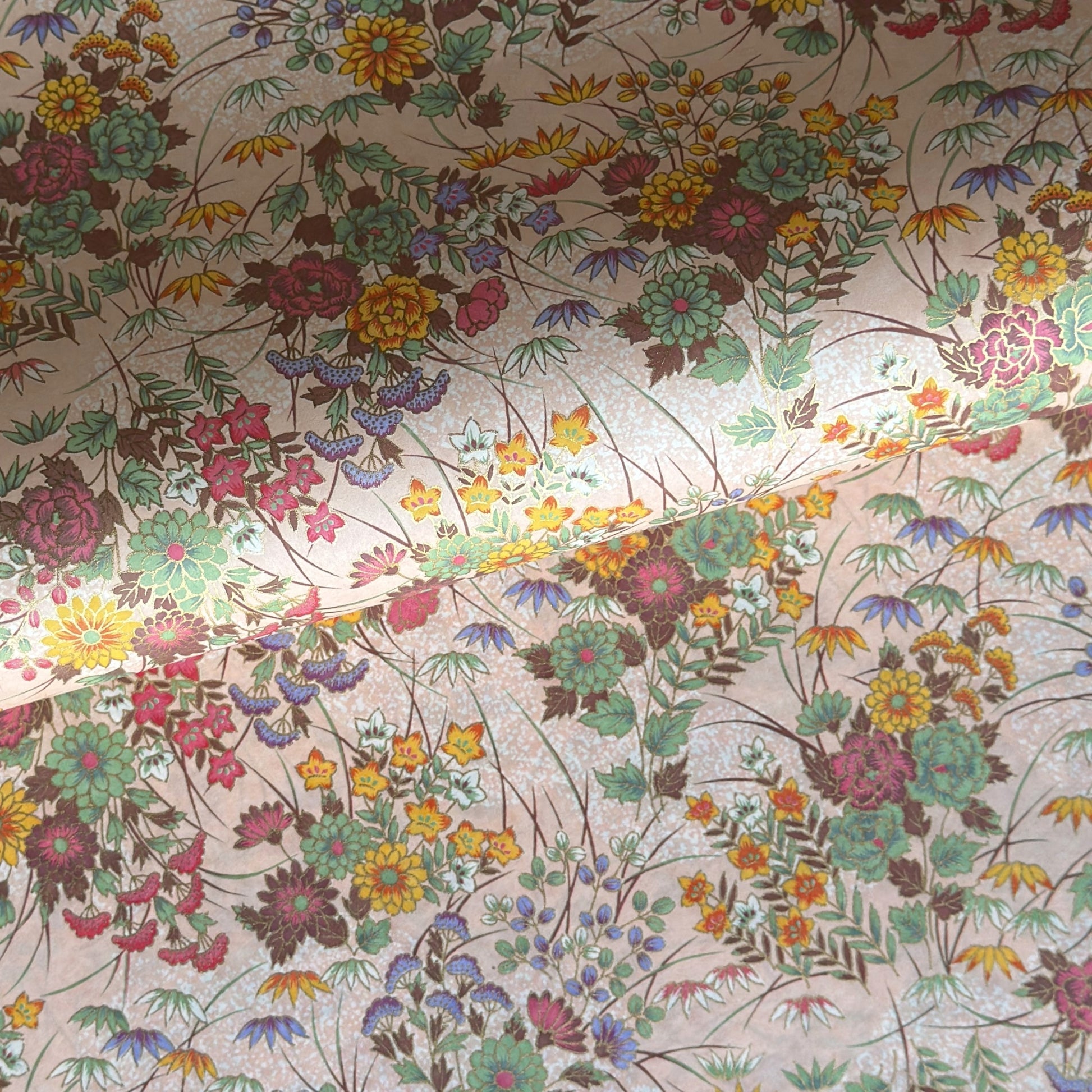 japanese silkscreen printed paper with a delicate floral bouquet design on blush pink background.