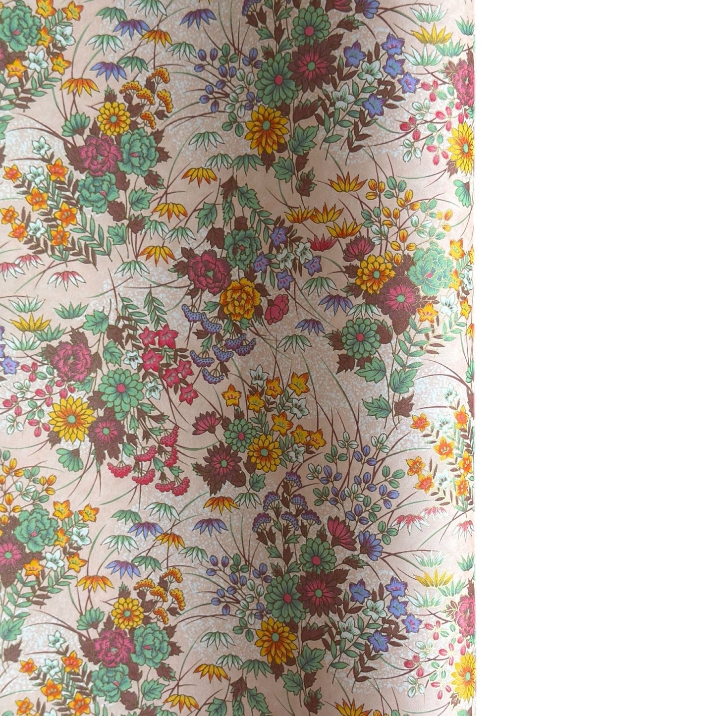 japanese silkscreen printed paper with a delicate floral bouquet design on blush pink background.