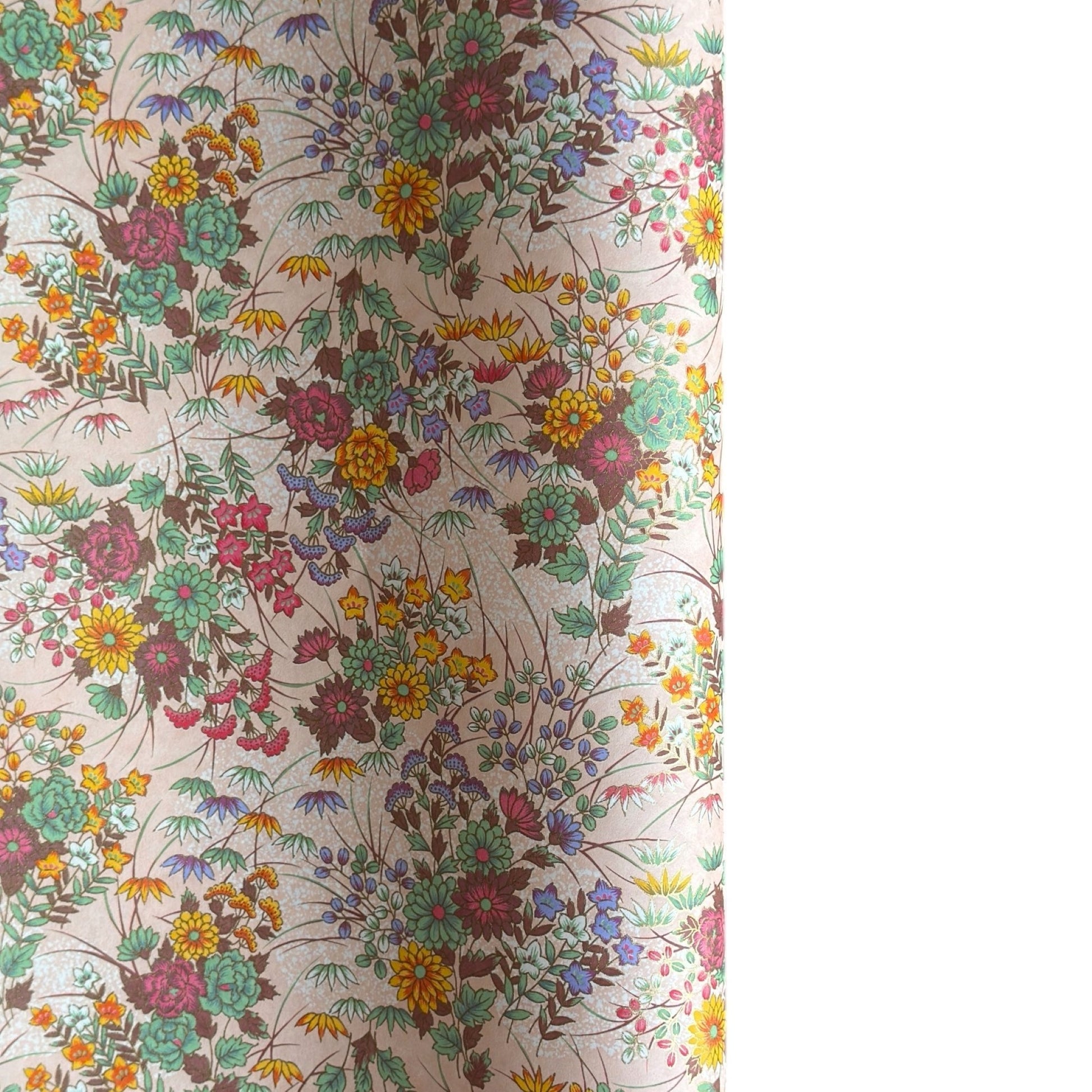 japanese silkscreen printed paper with a delicate floral bouquet design on blush pink background.