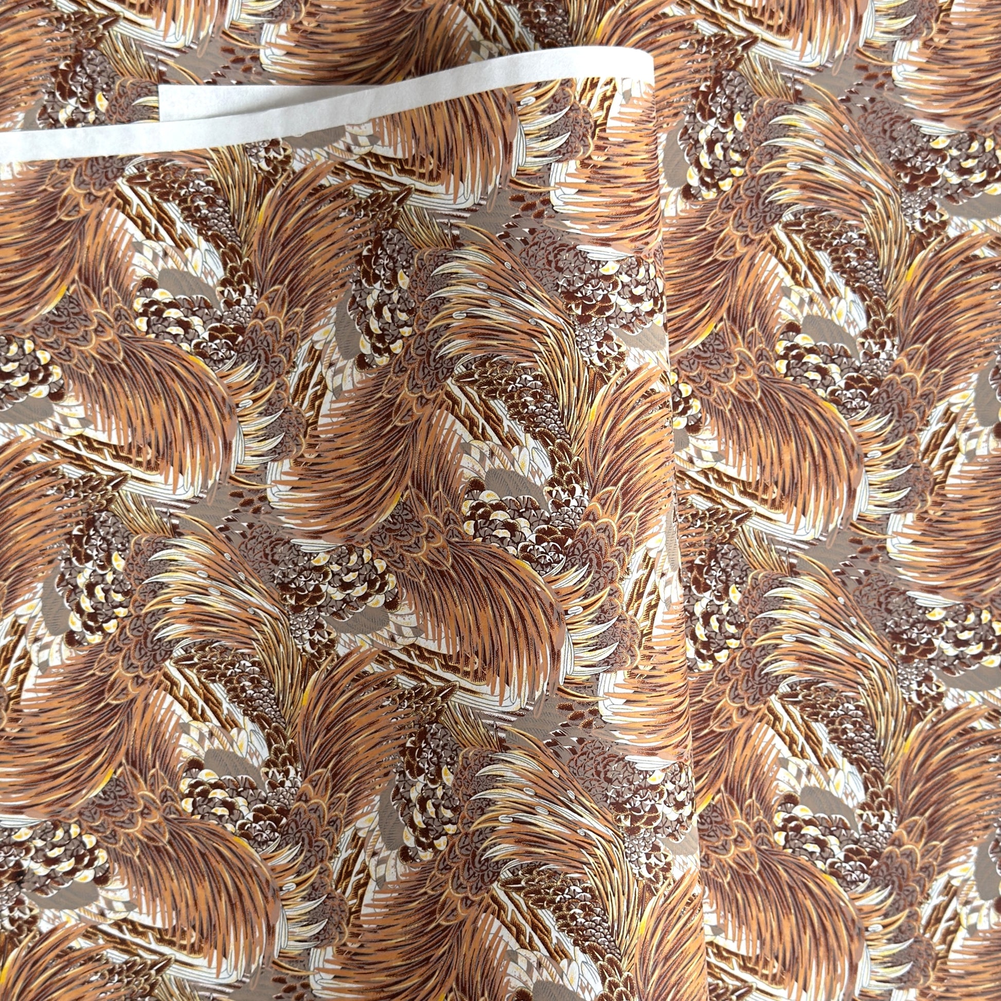 Detailed pattern of the plumage of feathers in brown, beige and ochre. Japanese chiyogami paper