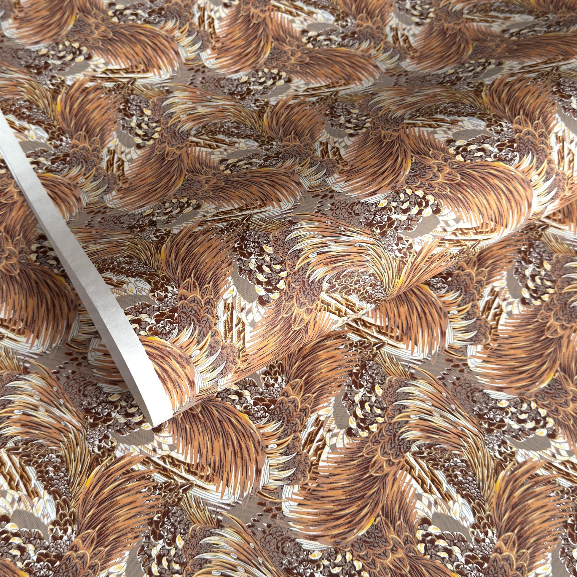Detailed pattern of the plumage of feathers in brown, beige and ochre. Japanese chiyogami paper