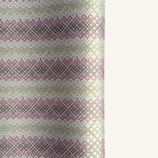 Japanese chiyogami silkscreen printed paper with rows of small flower motifs in purple, lilac and white on a taupe background with gold accents.