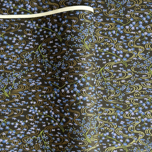 Gold rivers (kawa) with purple falling leaves (fukiyose) and foliage on a black backdrop. Japanese chiyogami paper