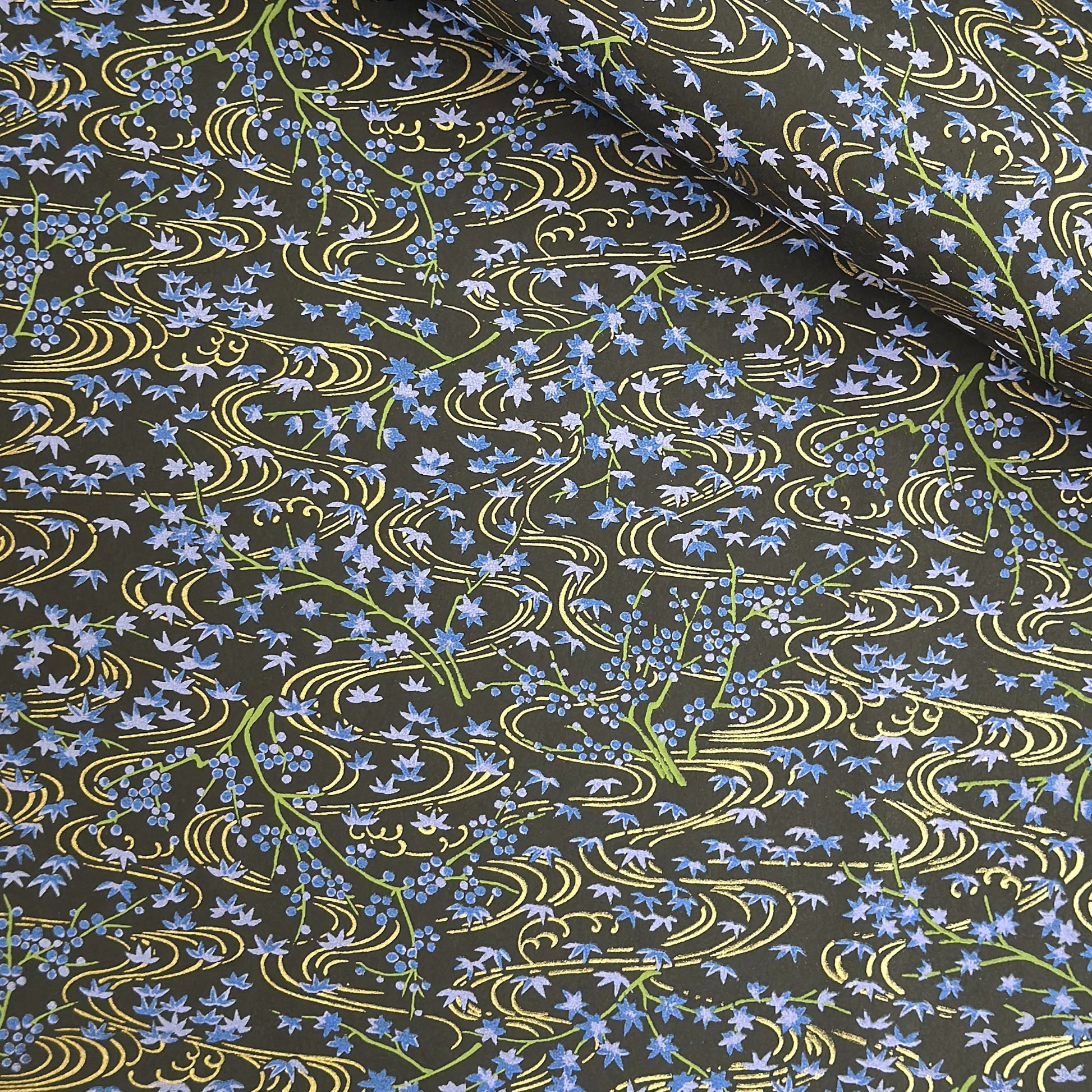 Gold rivers (kawa) with purple falling leaves (fukiyose) and foliage on a black backdrop. Japanese chiyogami paper