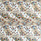 japanese silk-screen handmade paper showing taupe and pale blue waves pattern with multicolour flowers and foliage, with gold accents