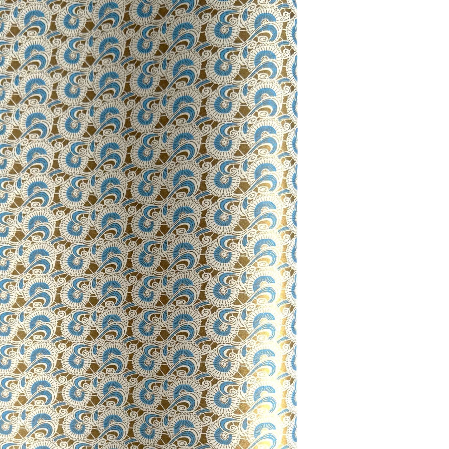 Japanese silkscreen chiyogami paper with a repeat floral pattern in gold an cerulean blue