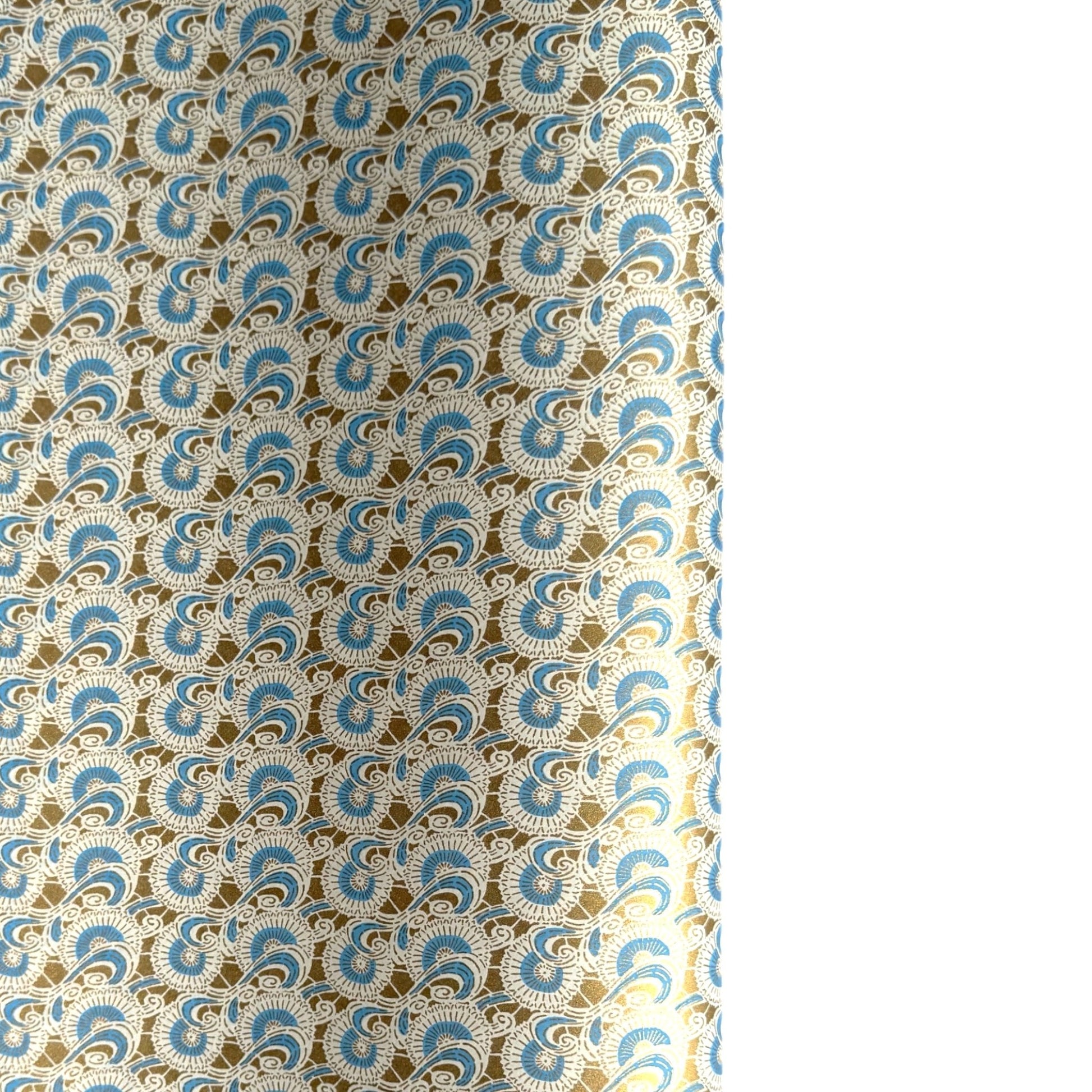 Japanese silkscreen chiyogami paper with a repeat floral pattern in gold an cerulean blue