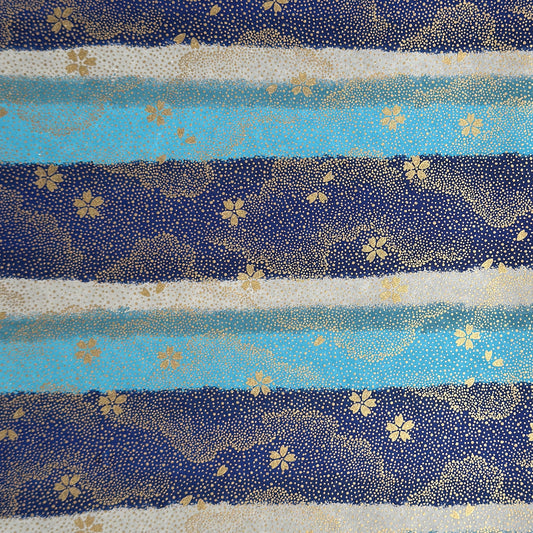 japanese chiyogami paper in stripes of blue, turquoise and grey with gold clouds and flowers