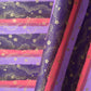japanese chiyogami paper in stripes of pink, lilac and purple with gold clouds and flowers
