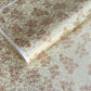 Pattern of scattered pine needles (matsuba) in gold and silver on a cream backdrop. Japanese chiyogami paper