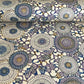 Japanese chiyogami silkscreen printed paper with a floral kiko pattern in purple and blue on a cream backdrop