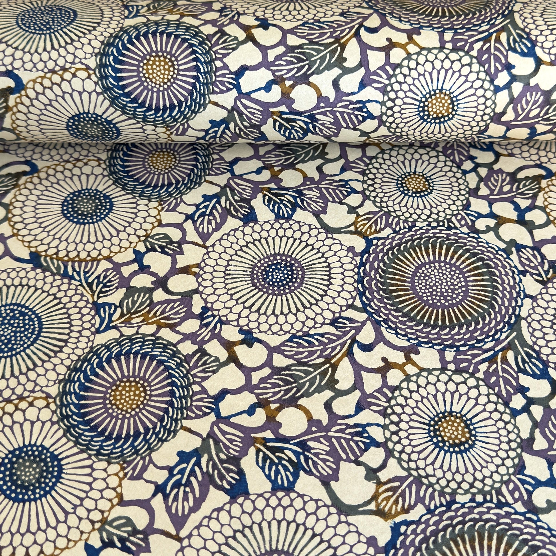 Japanese chiyogami silkscreen printed paper with a floral kiko pattern in purple and blue on a cream backdrop