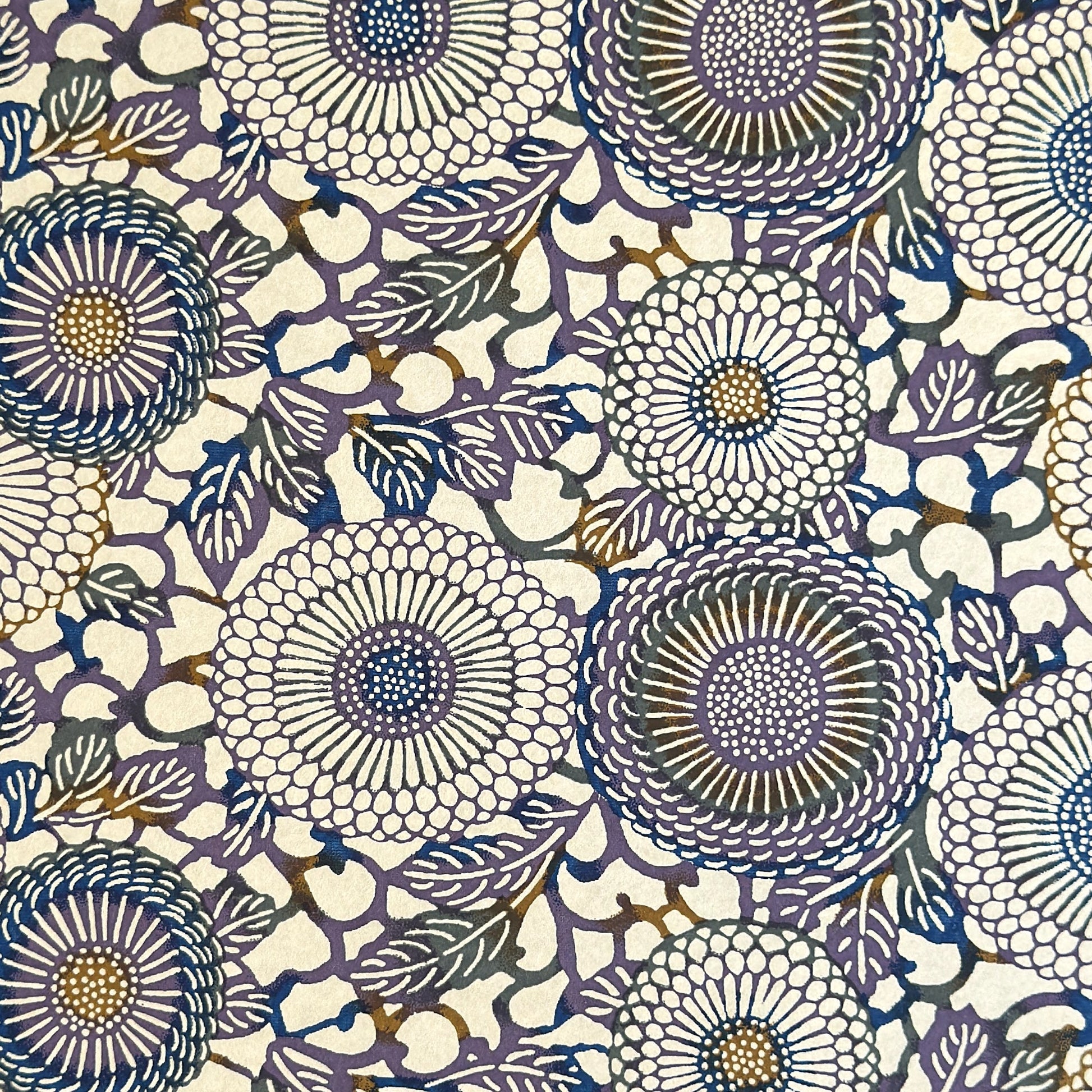 Japanese chiyogami silkscreen printed paper with a floral kiko pattern in purple and blue on a cream backdrop