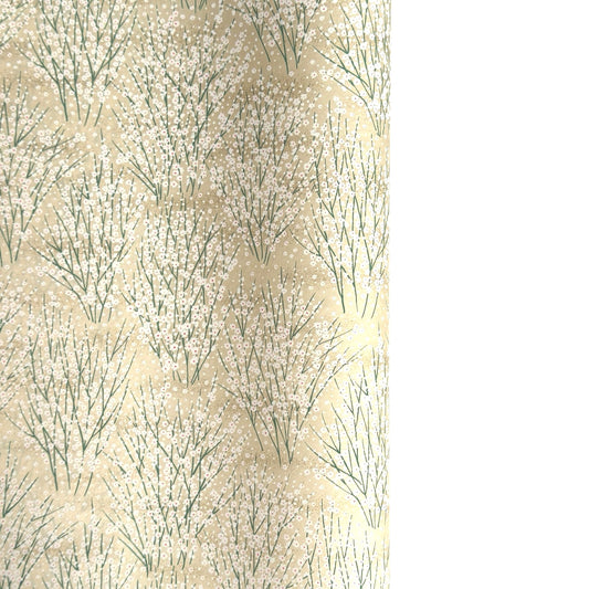 a sheet of Japanese silkscreen printed chiyogami paper with a delicate design of tufts of meadow grasses in flower in white, green on a cream background