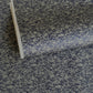 a sheet of Japanese chiyogami yuzen paper with a small abstract pattern in midnight blue on grey