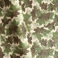 Japanese chiyogami paper with a pattern of green leaves in various tones with gold accent.