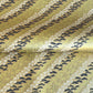 Japanese chiyogami paper with a design of trees, bamboo and plum blossom in indigo, green and white on a vintage gold backdrop. 