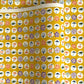japanese silk-screen handmade paper showing circles of traditional motifs on yellow backdrop