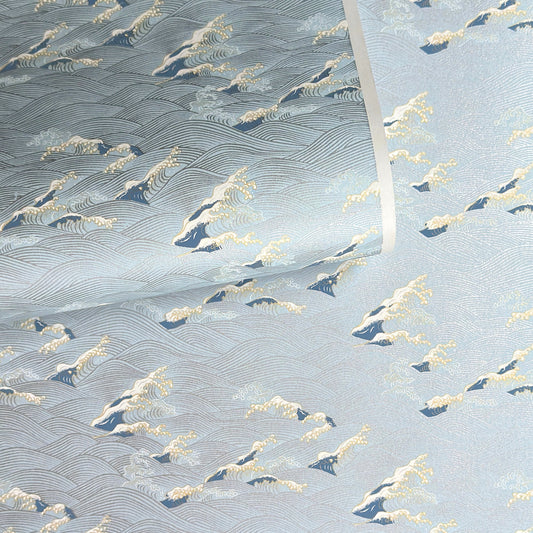 Japanese chiyogami paper with a wave pattern in pale blue, gold and silver.