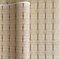 Japanese silkscreen chiyogami paper with a intricate filigree trellis design in brown with gold accent