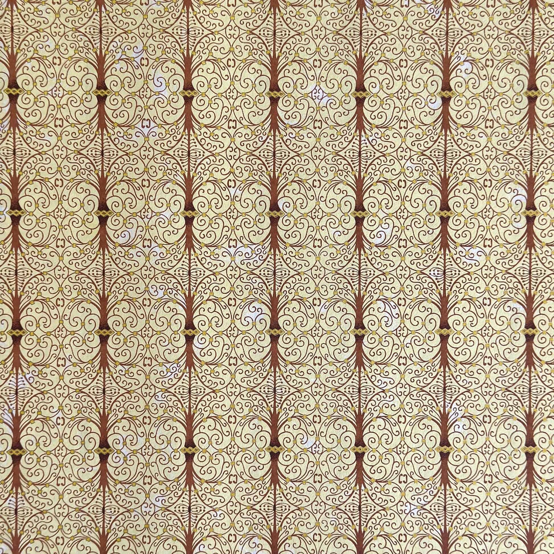 Japanese silkscreen chiyogami paper with a intricate filigree trellis design in brown with gold accent