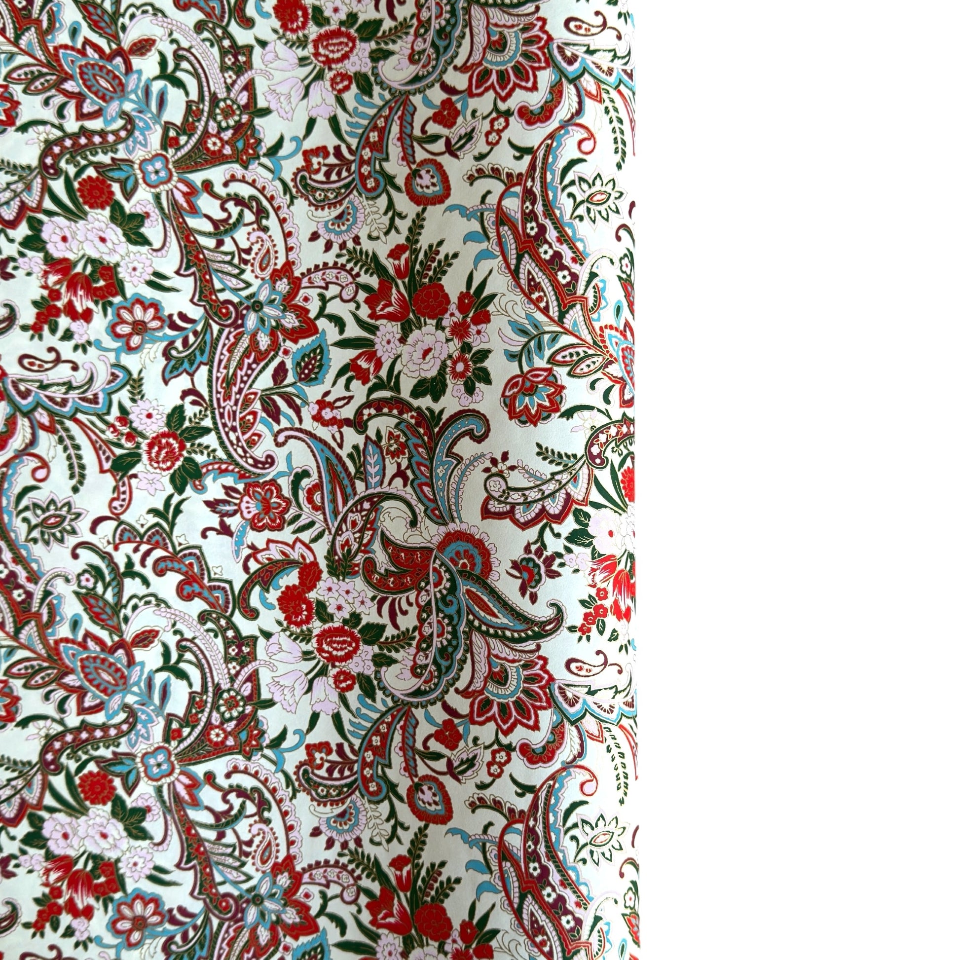 Japanese chiyogami paper silkscreened with a paisley floral style pattern in red, aqua, green and gold on a white background.