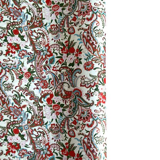 Japanese chiyogami paper silkscreened with a paisley floral style pattern in red, aqua, green and gold on a white background.