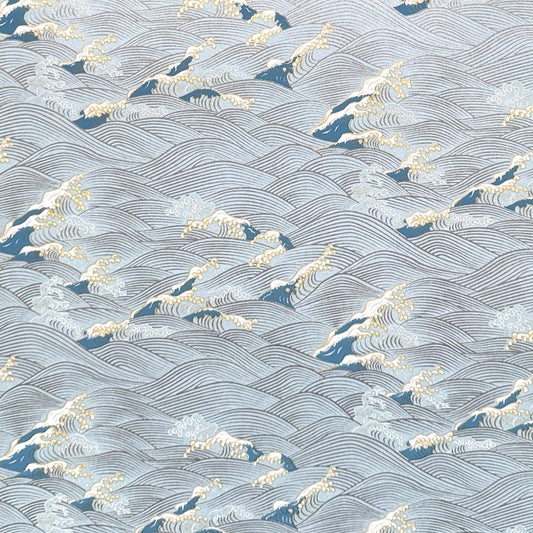 Japanese chiyogami paper with a wave pattern in pale blue, gold and silver.