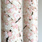 Japanese chiyogami paper with pale pink plum blossom, dark brown branches on an ivory background. Rolled 