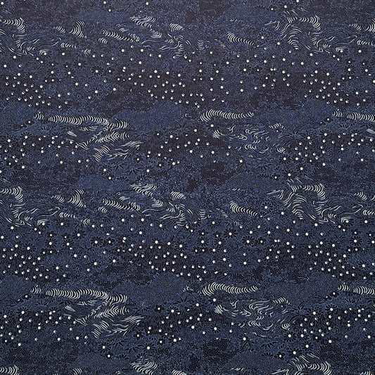 Japanese chiyogami paper.  Inky blue with a subtle pattern of a riverbank of flowers.