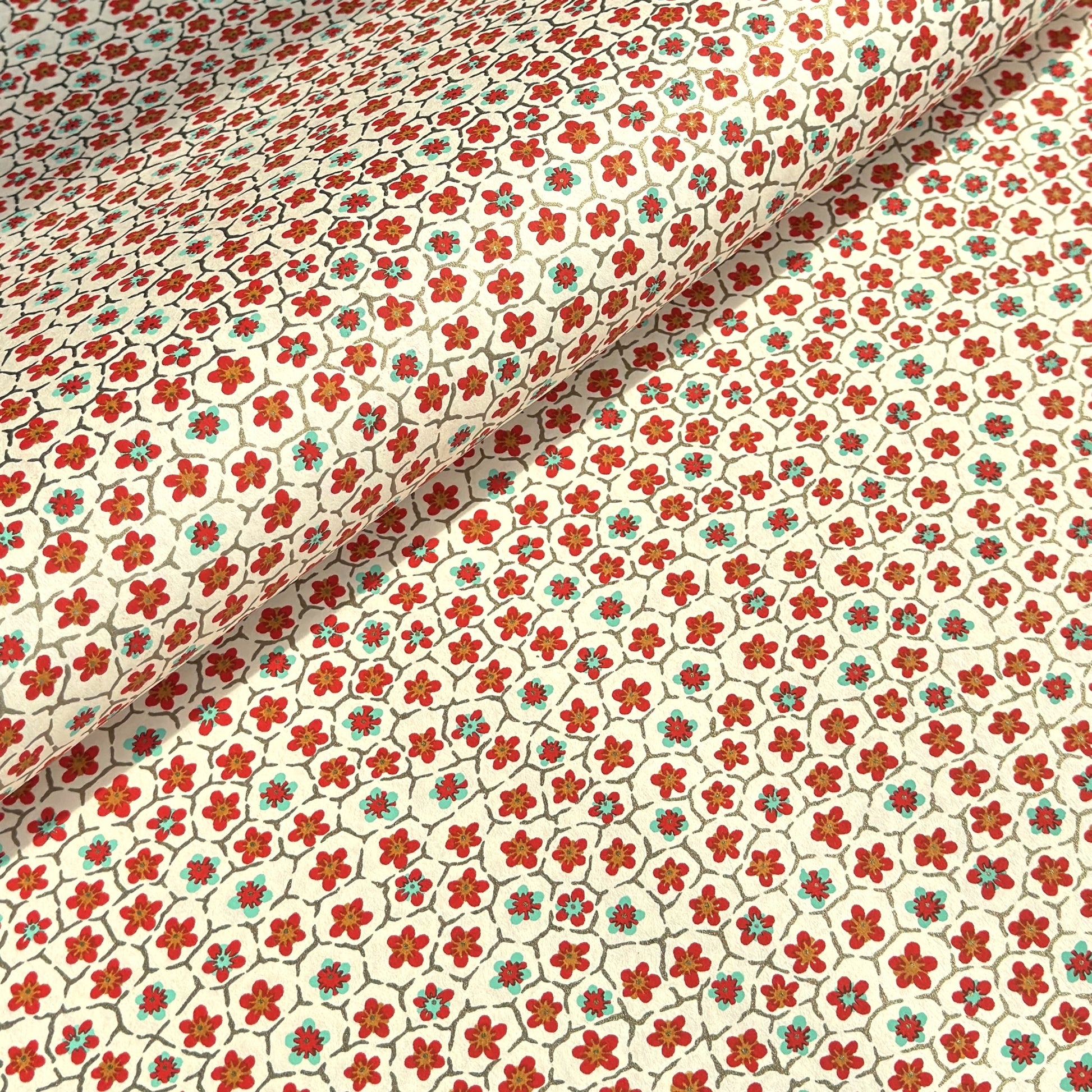 japanese silk-screen handmade paper, chiyogami, with red and aqua plum flowers repeat pattern