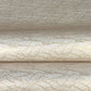 a sheet of Japanese silkscreen printed chiyogami paper with a copper wave design on white ground