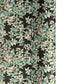 a sheet of Japanese chiyogami screen printed paper with a pattern of light green foliage on a black ground with silver botanical details