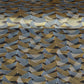 a sheet of Japanese chiyogami paper with gold and silver chevron stripes on black ground