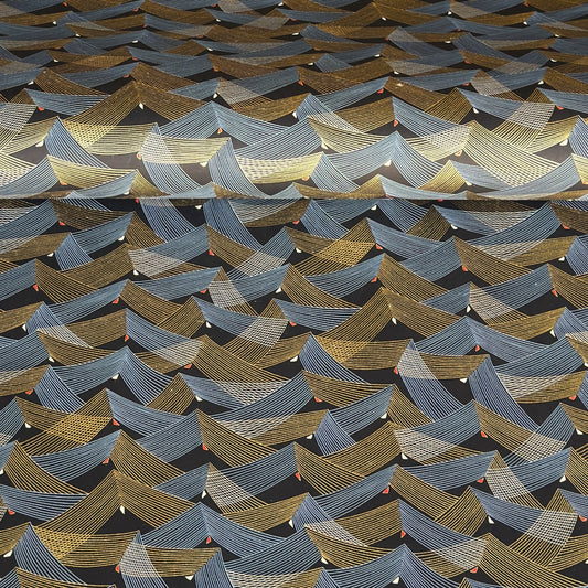a sheet of Japanese chiyogami paper with gold and silver chevron stripes on black ground