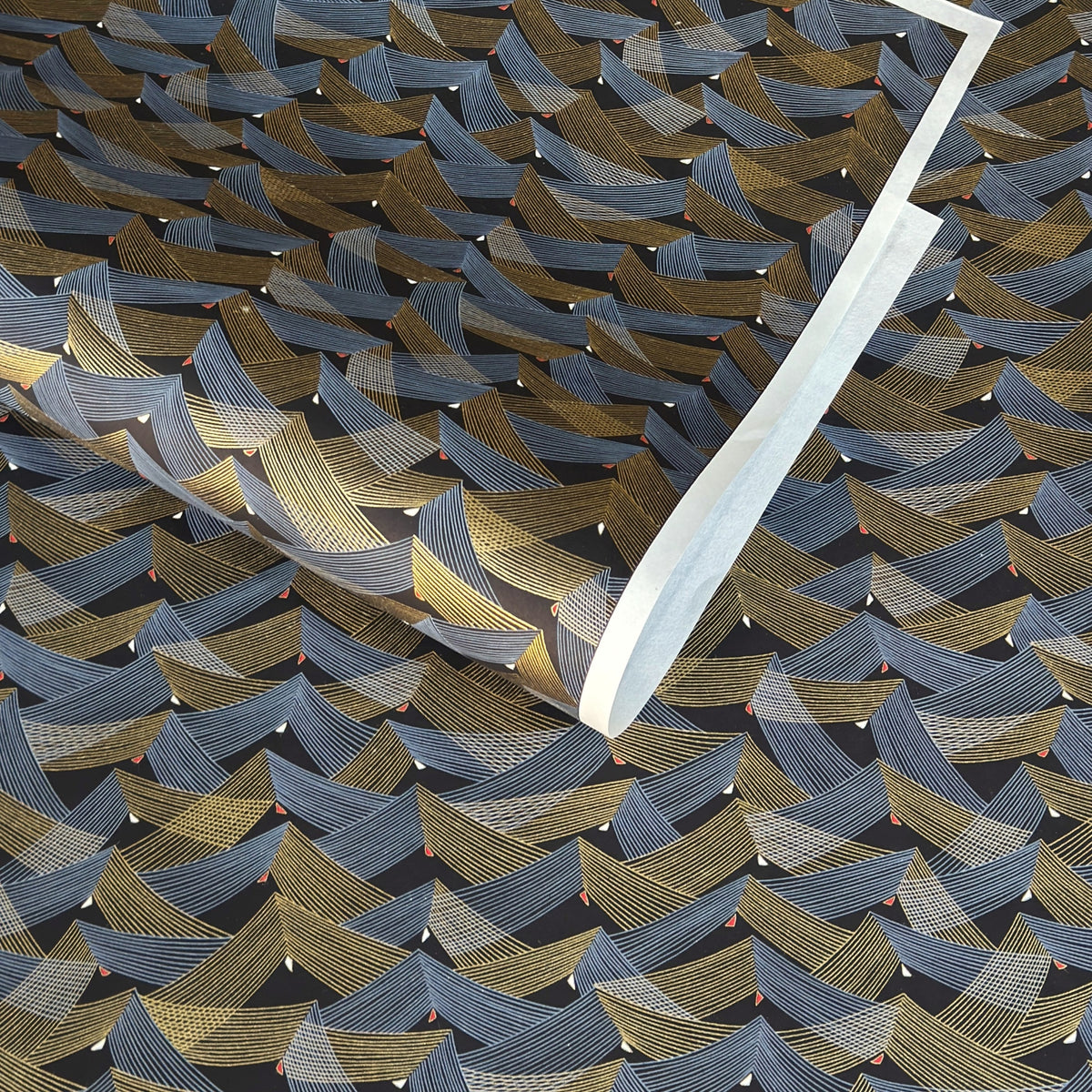 a sheet of Japanese chiyogami paper with gold and silver chevron stripes on black ground