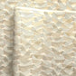 a sheet of Japanese chiyogami paper with gold and silver chevron lines on white paper