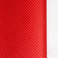 A close-up of a bright red sheet of chiyogami paper with a fine dotted pattern in gold. 