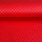 A close-up of a bright red sheet of chiyogami paper with a fine dotted pattern in gold. 