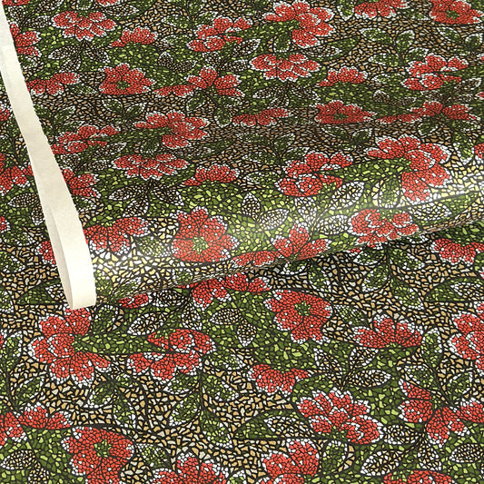 A close-up of a sheet of Japanese chiyogami paper with a repeating mosaic floral print. The design features red and flowers, green leaves on a black and gold mosaic background.