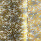 a sheet of Japanese yuzen chiyogami paper with a pattern of a flock of lots of birds flying. Birds are white, gold or copper in colour and flying on a ground of light grey and white sky